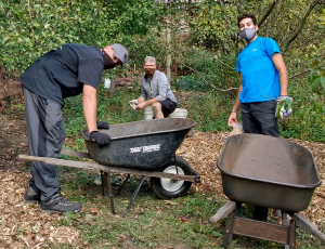 HQ Global Procurement team members volunteering for North Hills Community Outreach, October 2020.  Photo caption: David Ploskina (left), Jay Pollard (center), and Nicholas Goussetis (right).